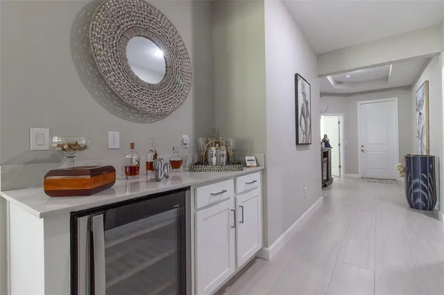 a view of a chairs and table in patio with a backyard