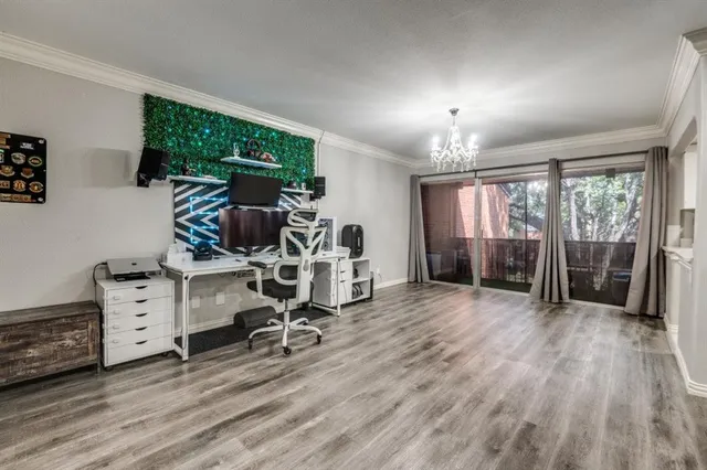 a view of a room with gym equipment and large window