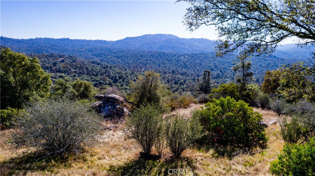 a view of a house with a mountain in the background