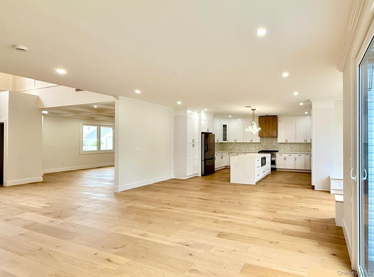 60 Periwinkle Road Levittown, NY 11756 - Photo 33 of 33 a view of an empty room with kitchen and a window