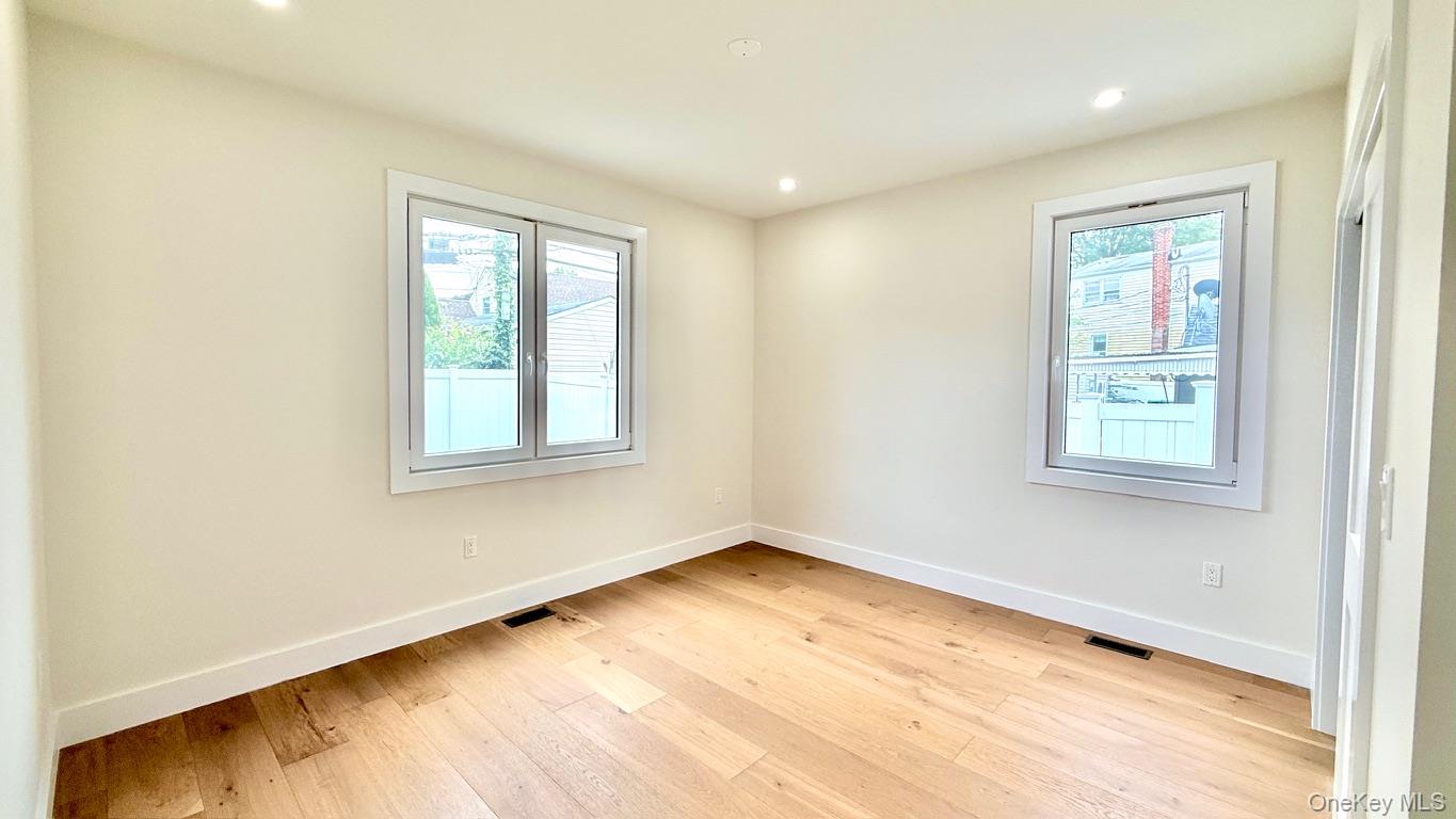 60 Periwinkle Road Levittown, NY 11756 - Photo 13 of 33 a view of an empty room with a window