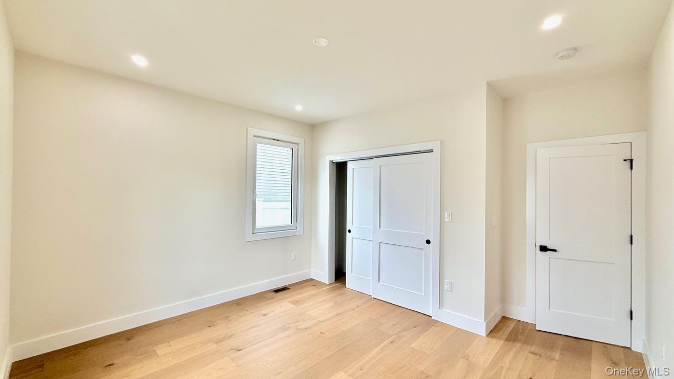 60 Periwinkle Road Levittown, NY 11756 - Photo 14 of 33 an empty room with closet and a bathroom