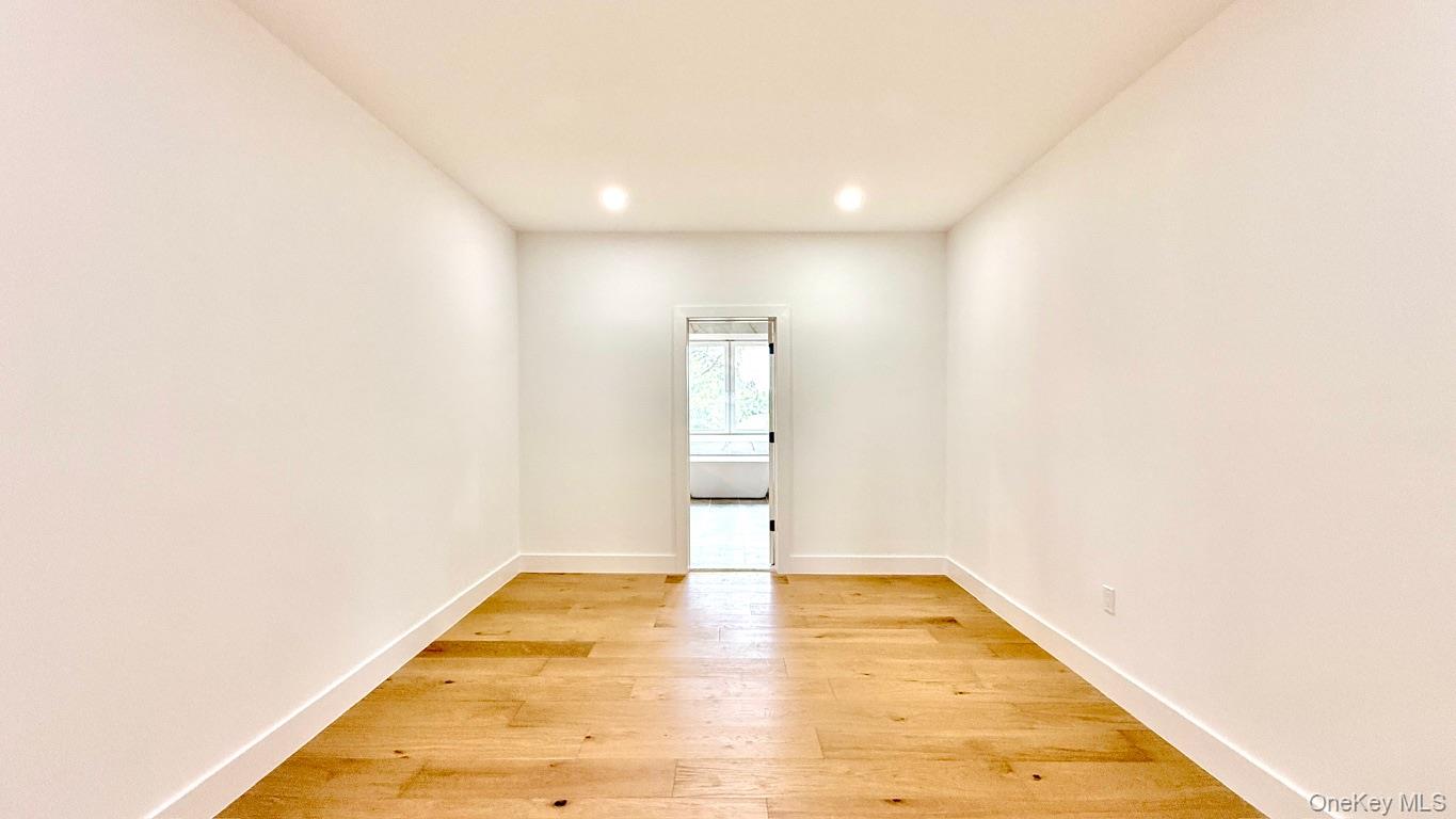 60 Periwinkle Road Levittown, NY 11756 - Photo 21 of 33 a view of empty room with wooden floor