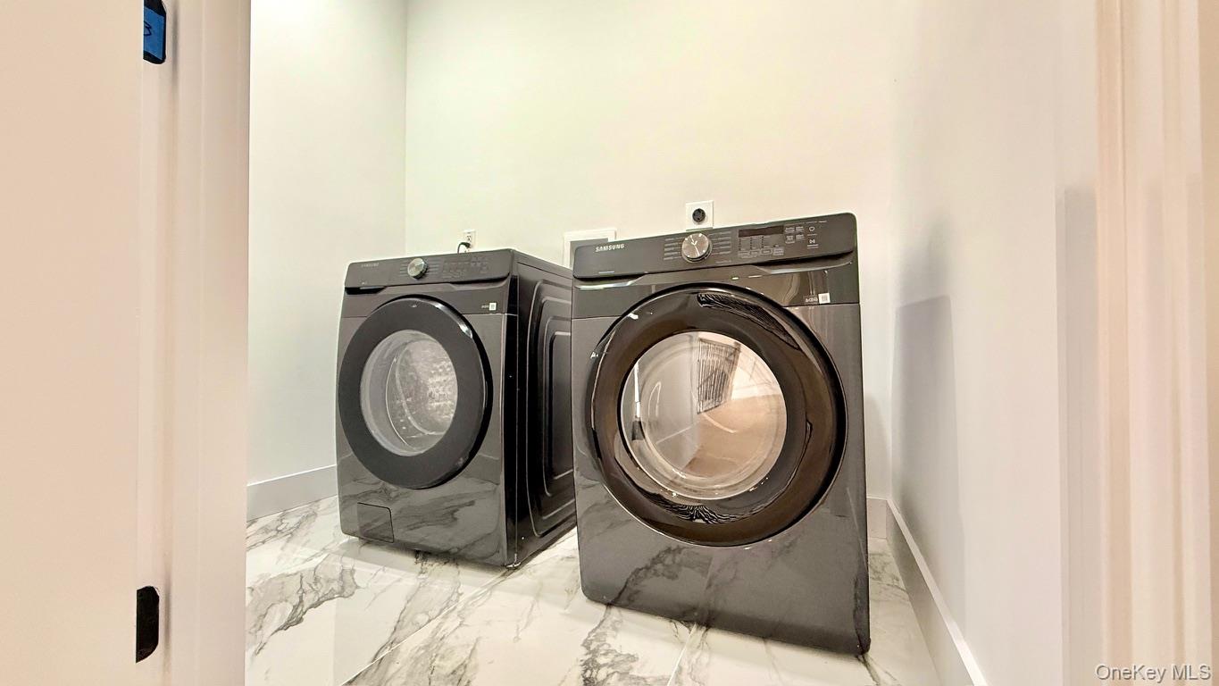60 Periwinkle Road Levittown, NY 11756 - Photo 31 of 33 a utility room with dryer and washer