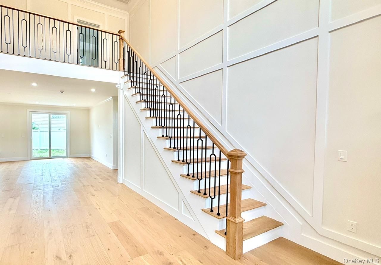 60 Periwinkle Road Levittown, NY 11756 - Photo 8 of 33 a view of staircase with railing and white walls