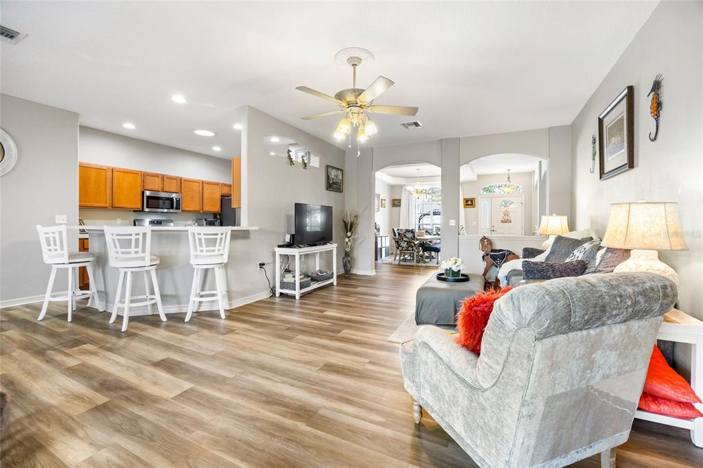 15092 Southwest 14th Avenue Road Ocala, FL 34473 - Photo 12 of 40 a living room with furniture and kitchen view