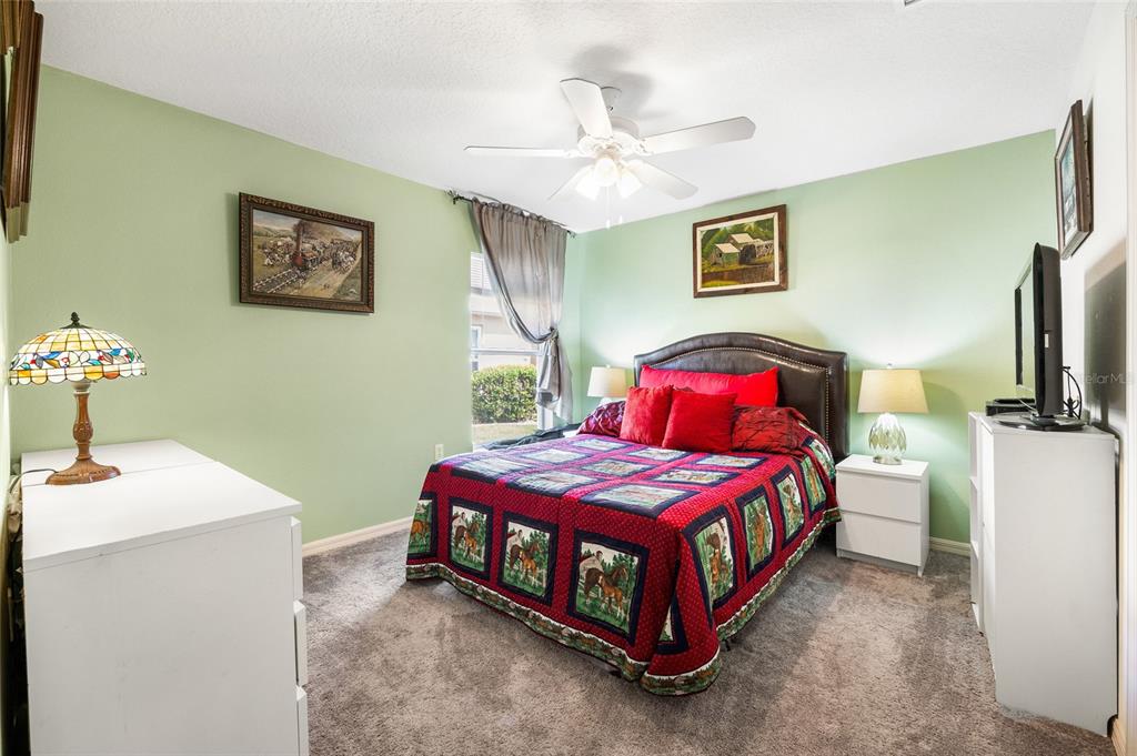 15092 Southwest 14th Avenue Road Ocala, FL 34473 - Photo 20 of 40 a bedroom with a bed and a table in it