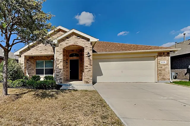 a view of a house with a garage
