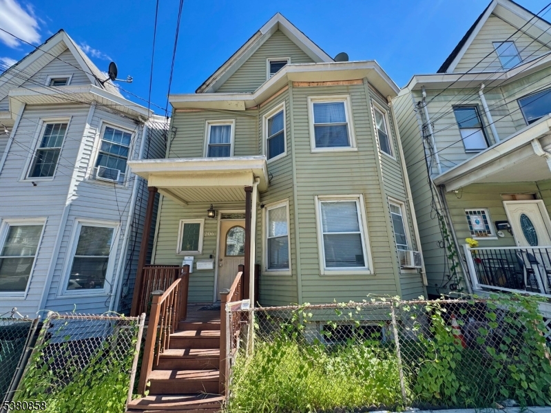 206 North 6th Street Prospect Park, NJ 07508 - Photo 2 of 18 a front view of a house with a yard