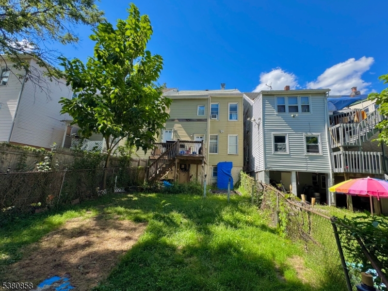 206 North 6th Street Prospect Park, NJ 07508 - Photo 4 of 18 a view of a house with backyard porch and sitting area