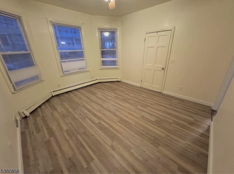 206 North 6th Street Prospect Park, NJ 07508 - Photo 7 of 18 wooden floor in an empty room