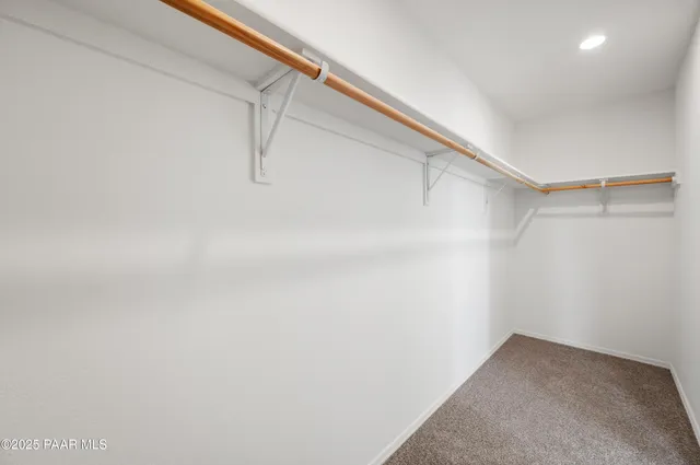 wooden floor with a view of bathroom