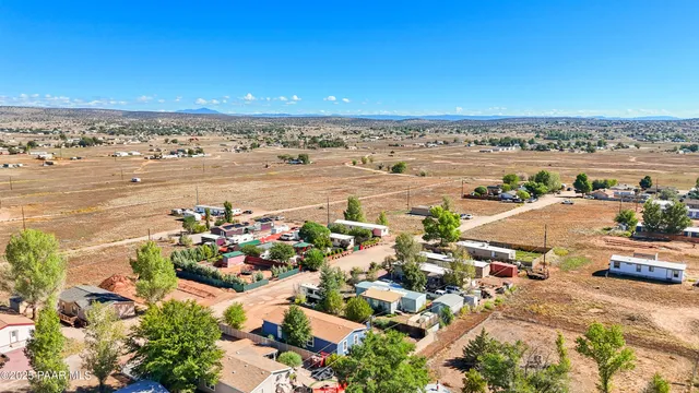 an aerial view of residential building and lake