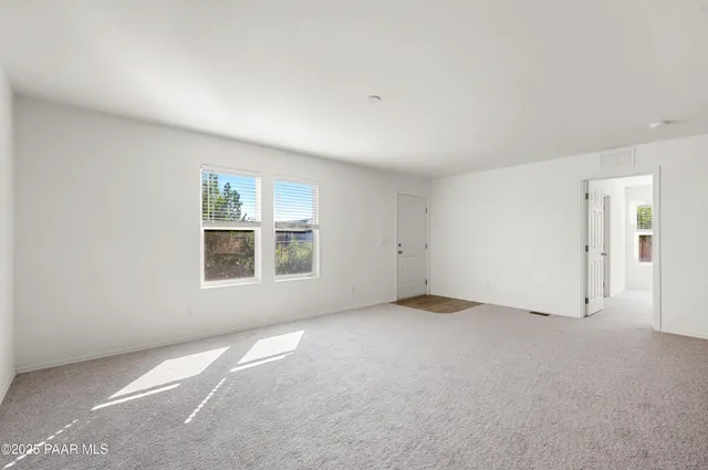 a view of kitchen with refrigerator sink and microwave