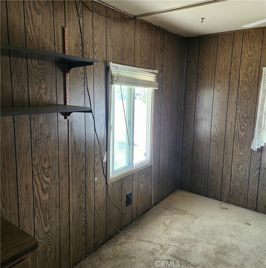 15940 Stoddard Wells Road, Unit 30 Victorville, CA 92395 - Photo 9 of 17 Bedroom #1 with bookshelves.
