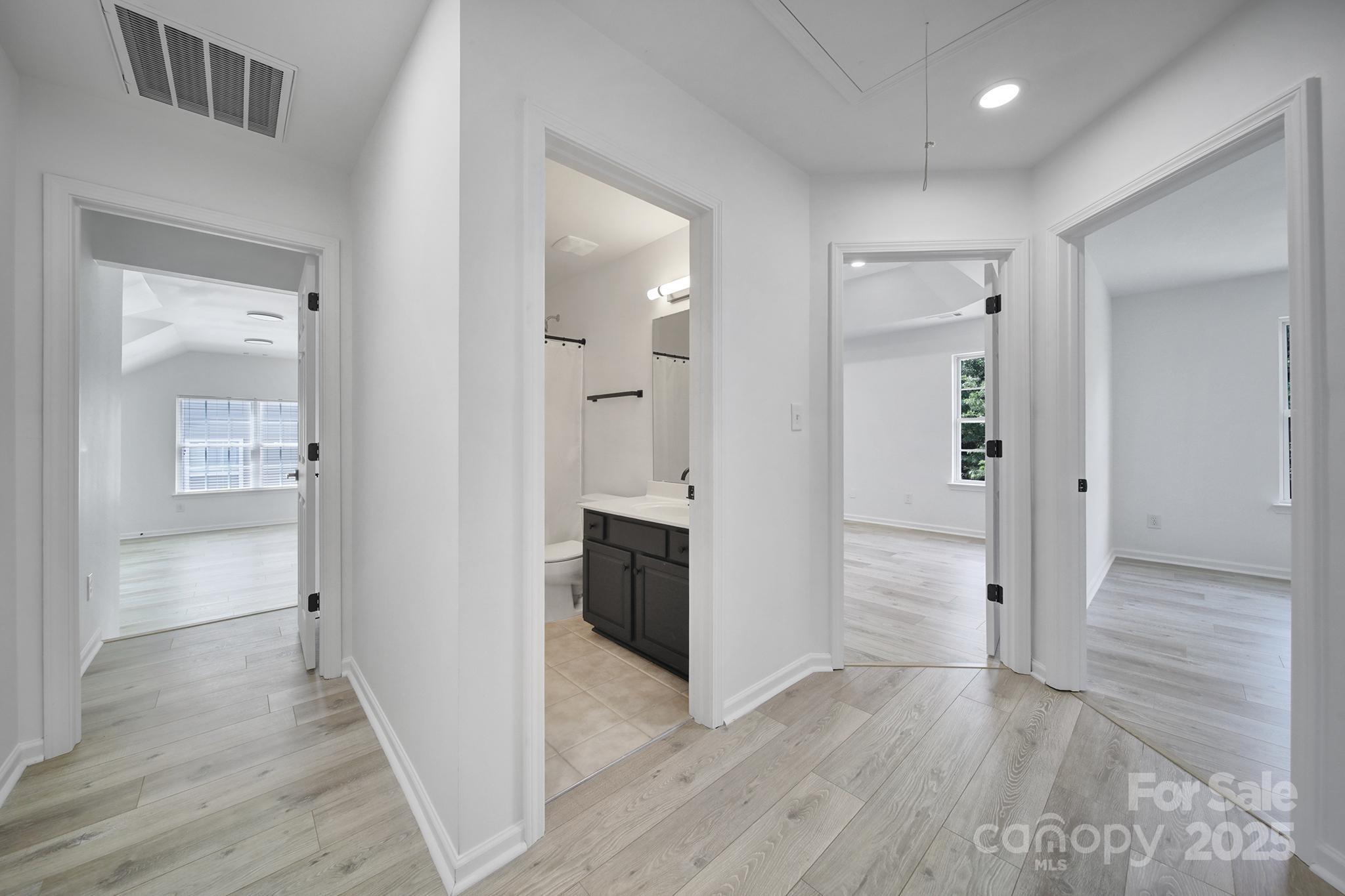 13425 Meadowmere Road Huntersville, NC 28078 - Photo 19 of 41 wooden floor with white walls