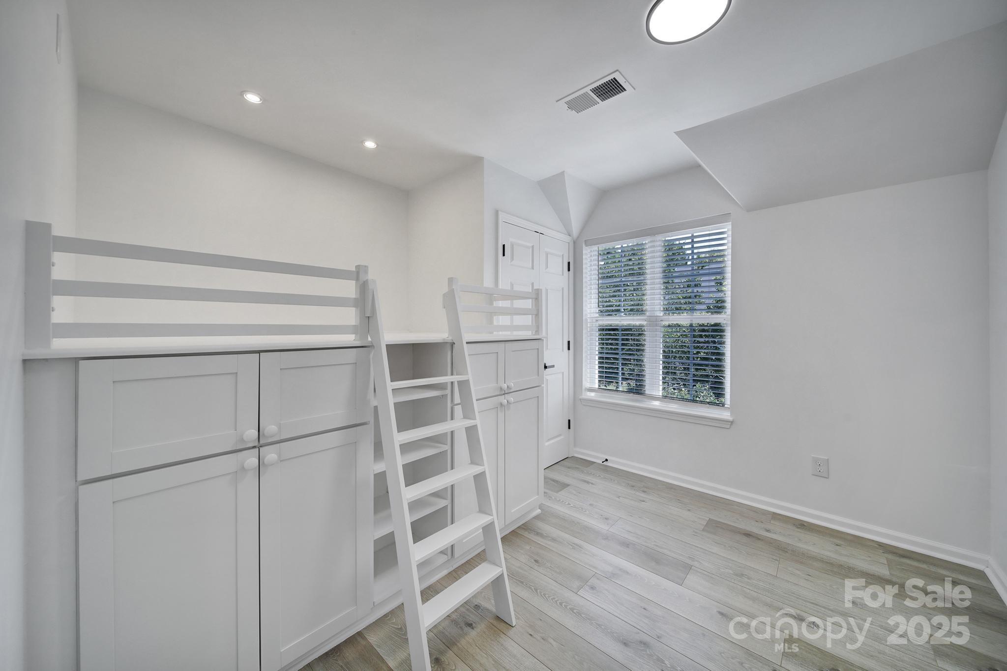 13425 Meadowmere Road Huntersville, NC 28078 - Photo 20 of 41 a view of wooden floor and windows in a room