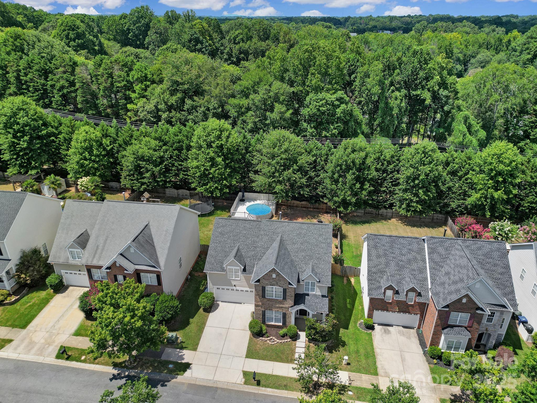 13425 Meadowmere Road Huntersville, NC 28078 - Photo 2 of 41 an aerial view of a house with a yard and lake view