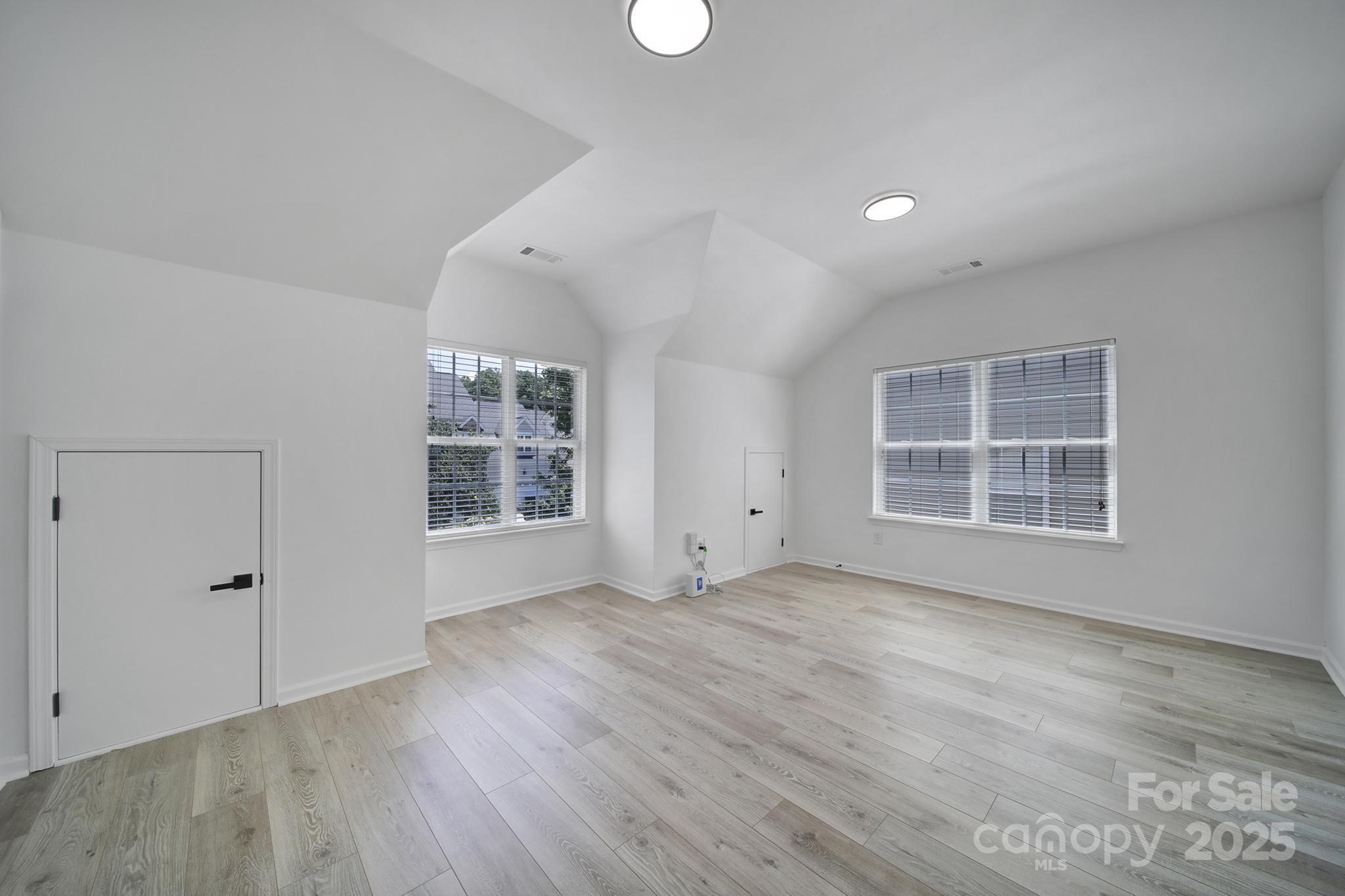 13425 Meadowmere Road Huntersville, NC 28078 - Photo 24 of 41 wooden floor in an empty room with a window