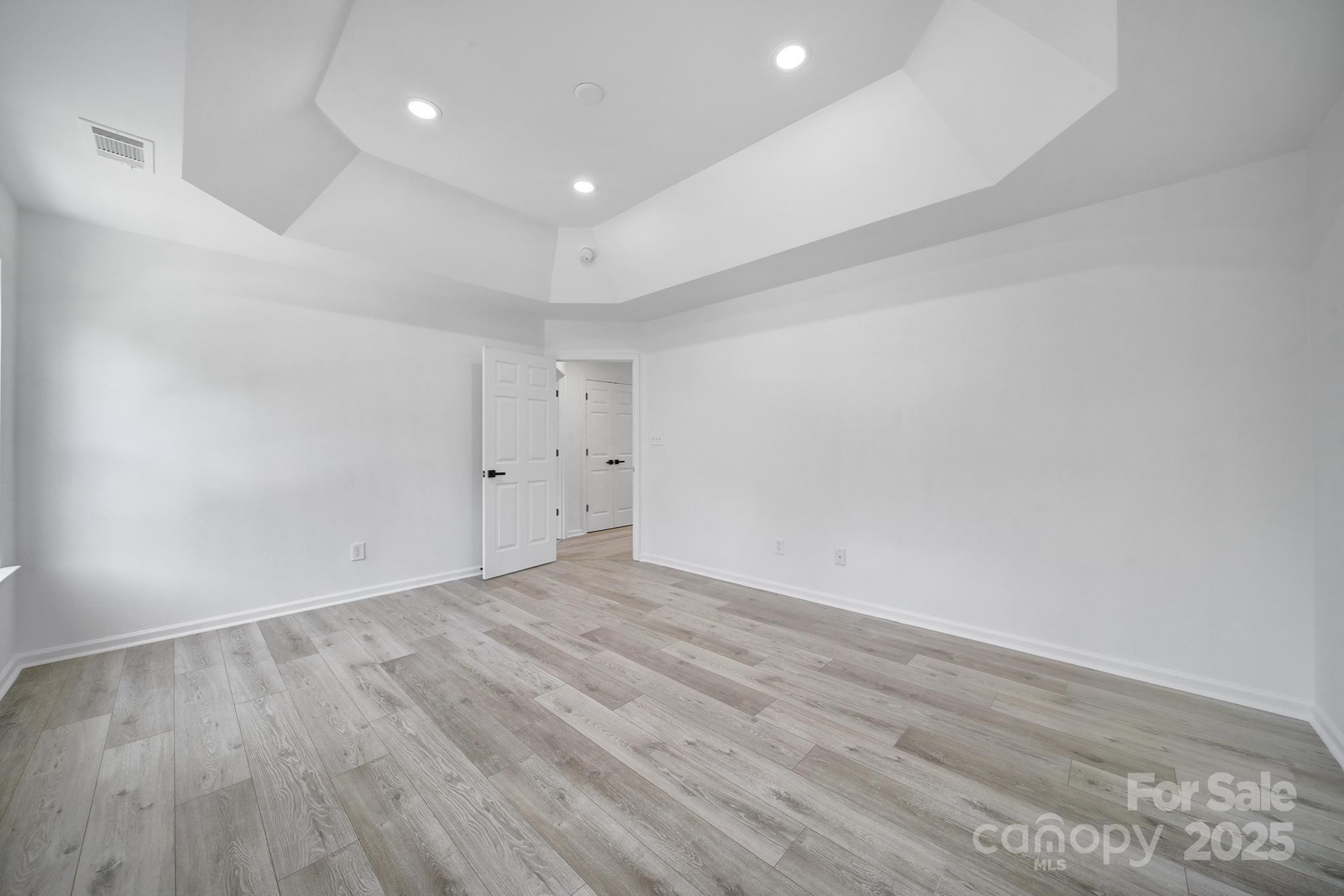 13425 Meadowmere Road Huntersville, NC 28078 - Photo 29 of 41 an empty room with wooden floor