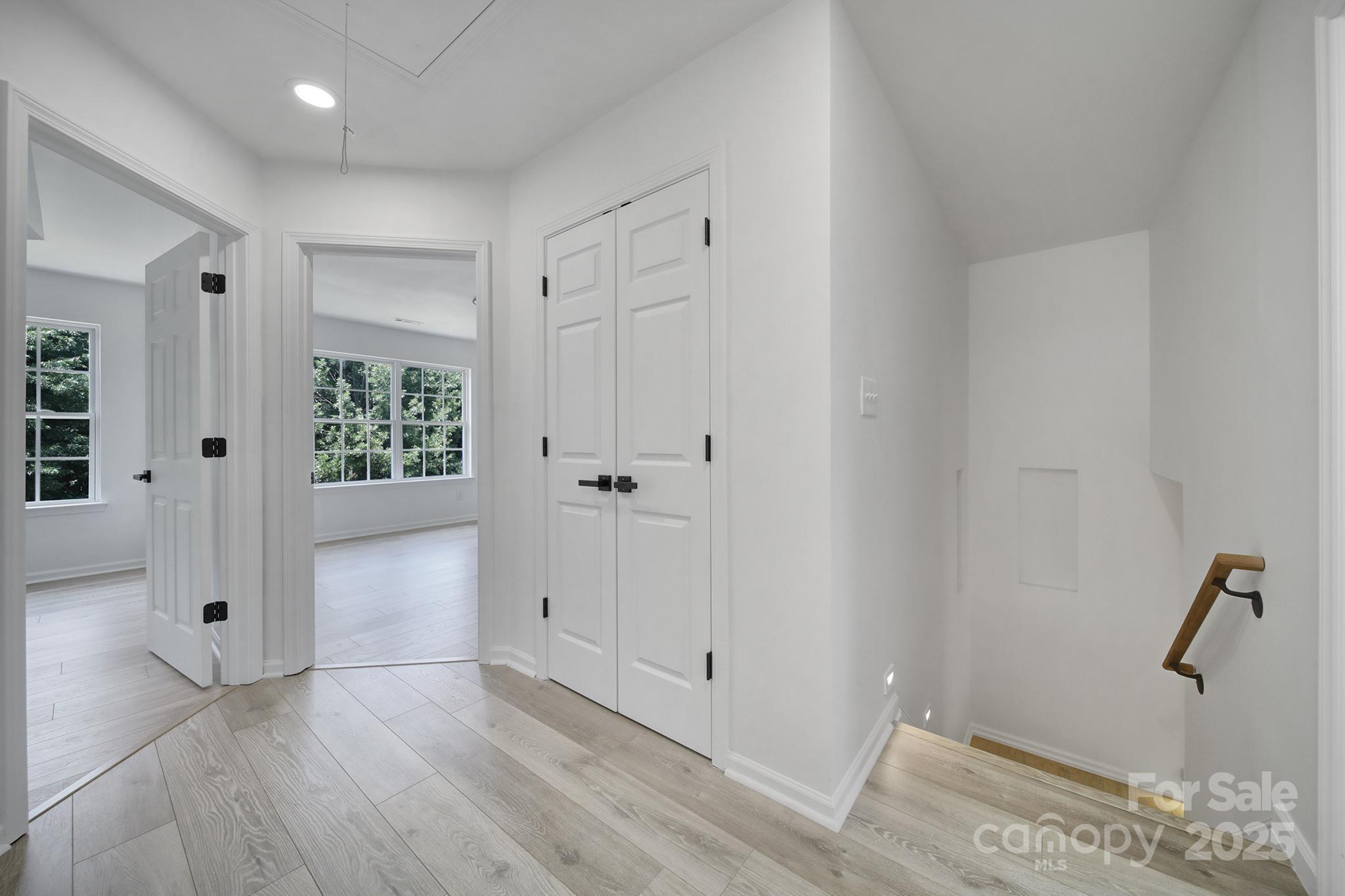 13425 Meadowmere Road Huntersville, NC 28078 - Photo 33 of 41 wooden floor with white walls