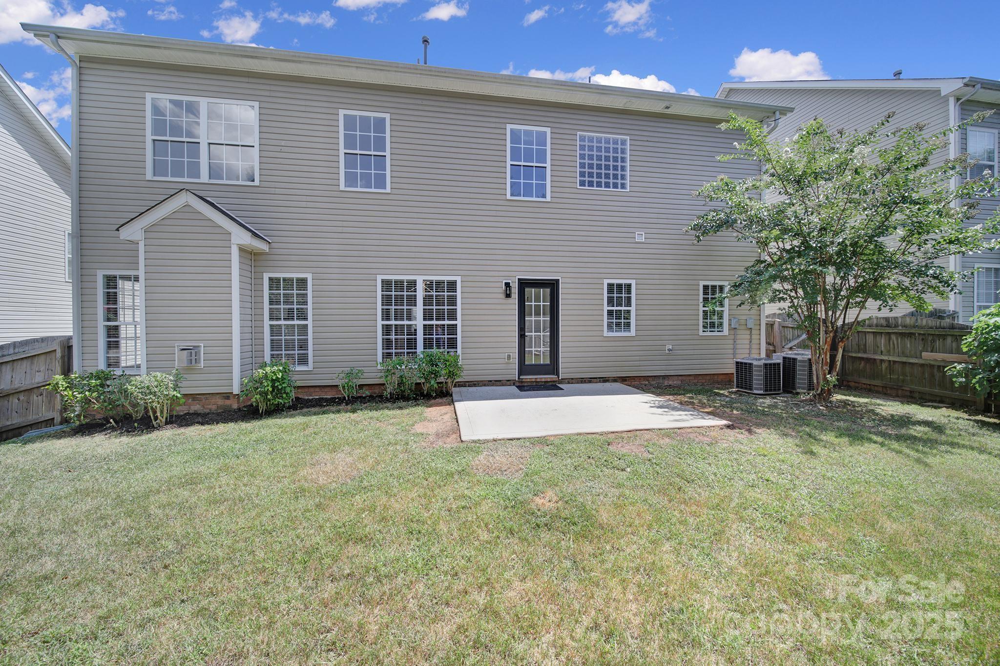 13425 Meadowmere Road Huntersville, NC 28078 - Photo 36 of 41 a front view of a house with a yard and garage
