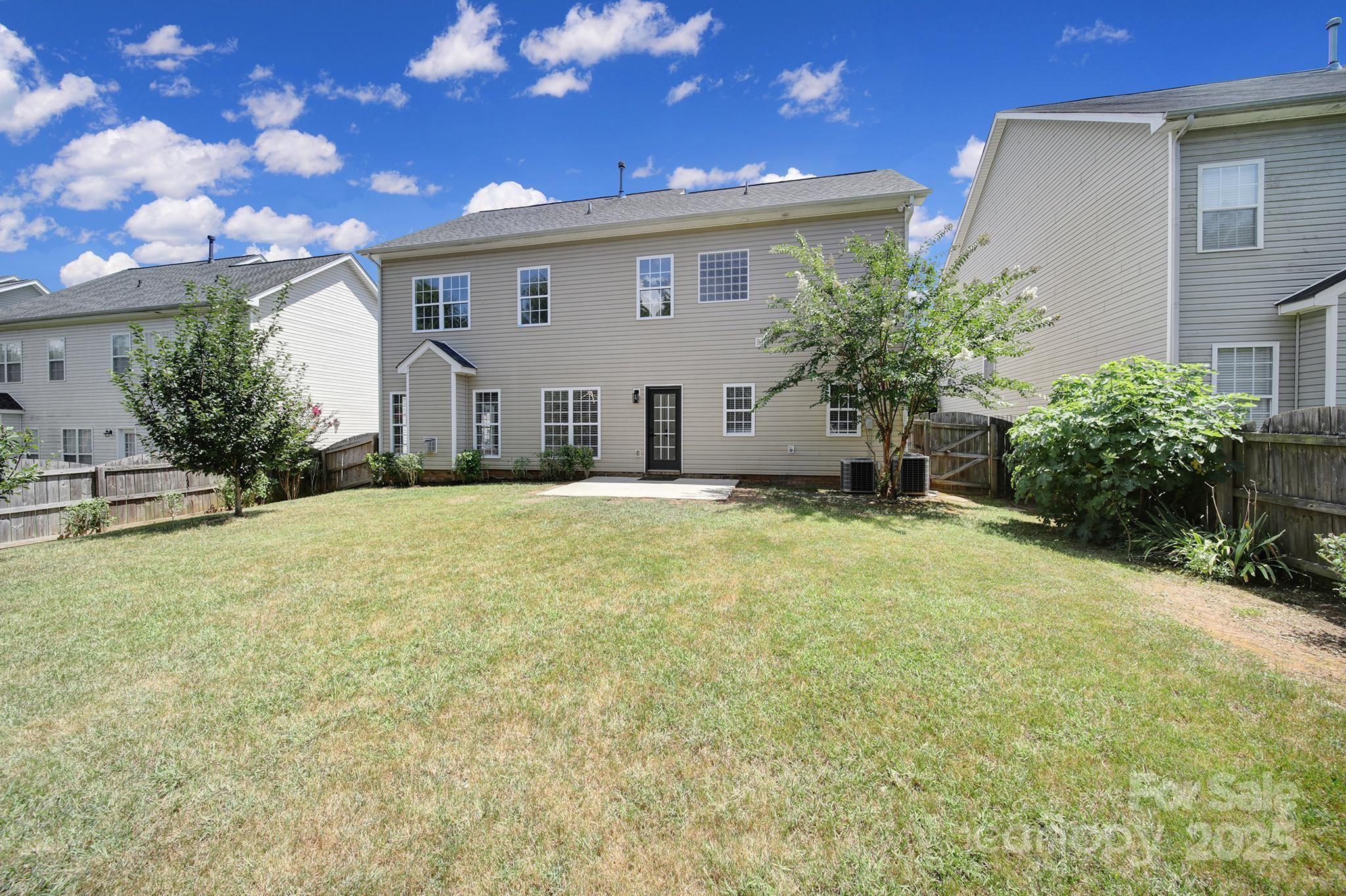 13425 Meadowmere Road Huntersville, NC 28078 - Photo 38 of 41 a front view of house with yard and trees in the background