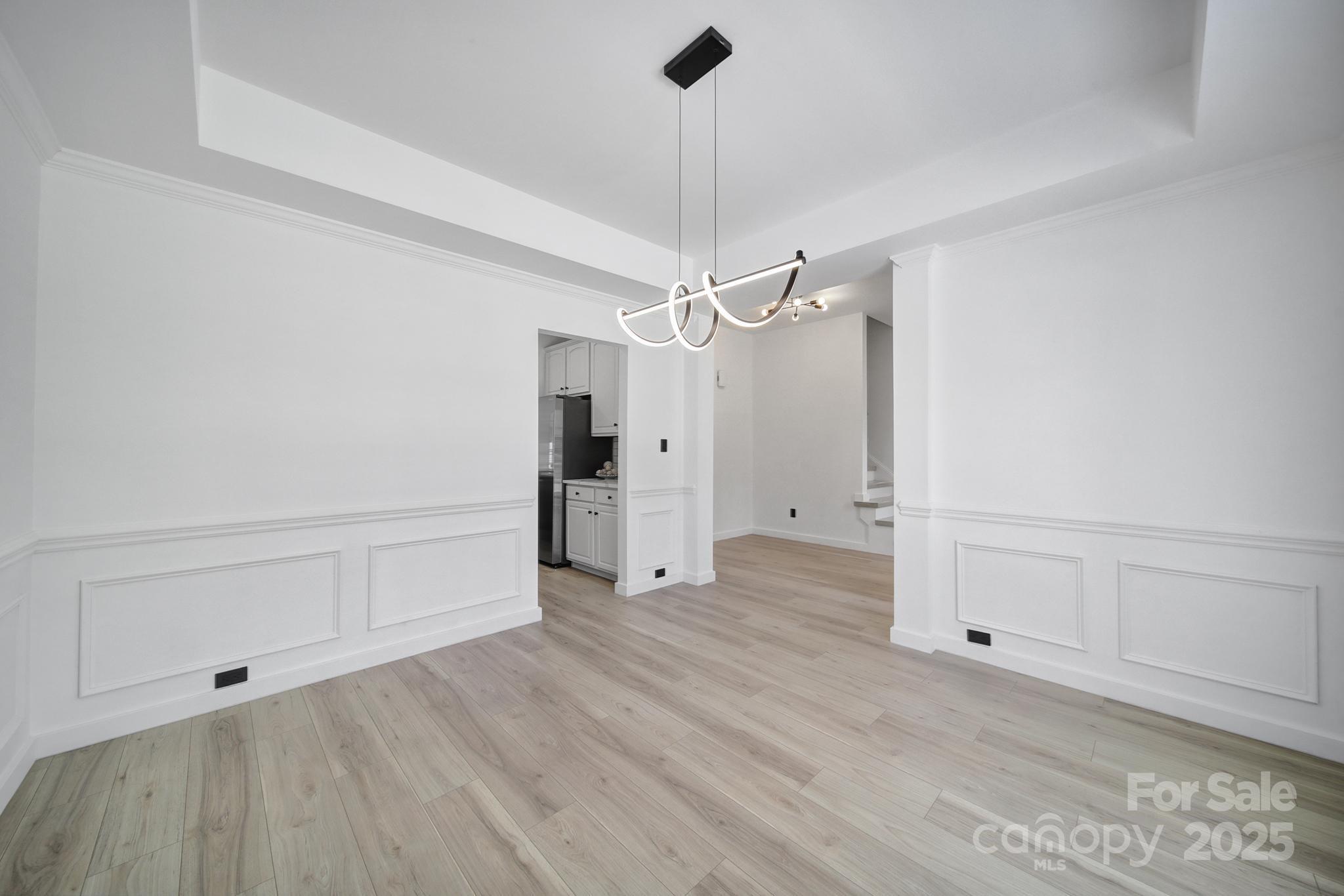 13425 Meadowmere Road Huntersville, NC 28078 - Photo 6 of 41 a view of empty room with wooden floor