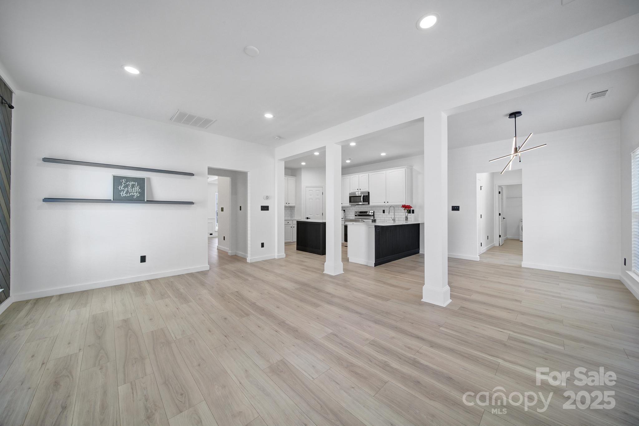 13425 Meadowmere Road Huntersville, NC 28078 - Photo 10 of 41 a view of a kitchen with a sink and a refrigerator
