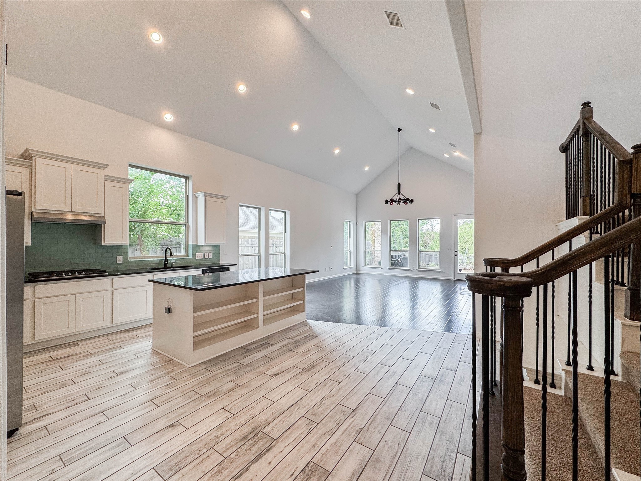 3810 Brushy Creek Road, Unit 73 Cedar Park, TX 78613 - Photo 12 of 42 a large kitchen with stainless steel appliances granite countertop a stove and a wooden floors