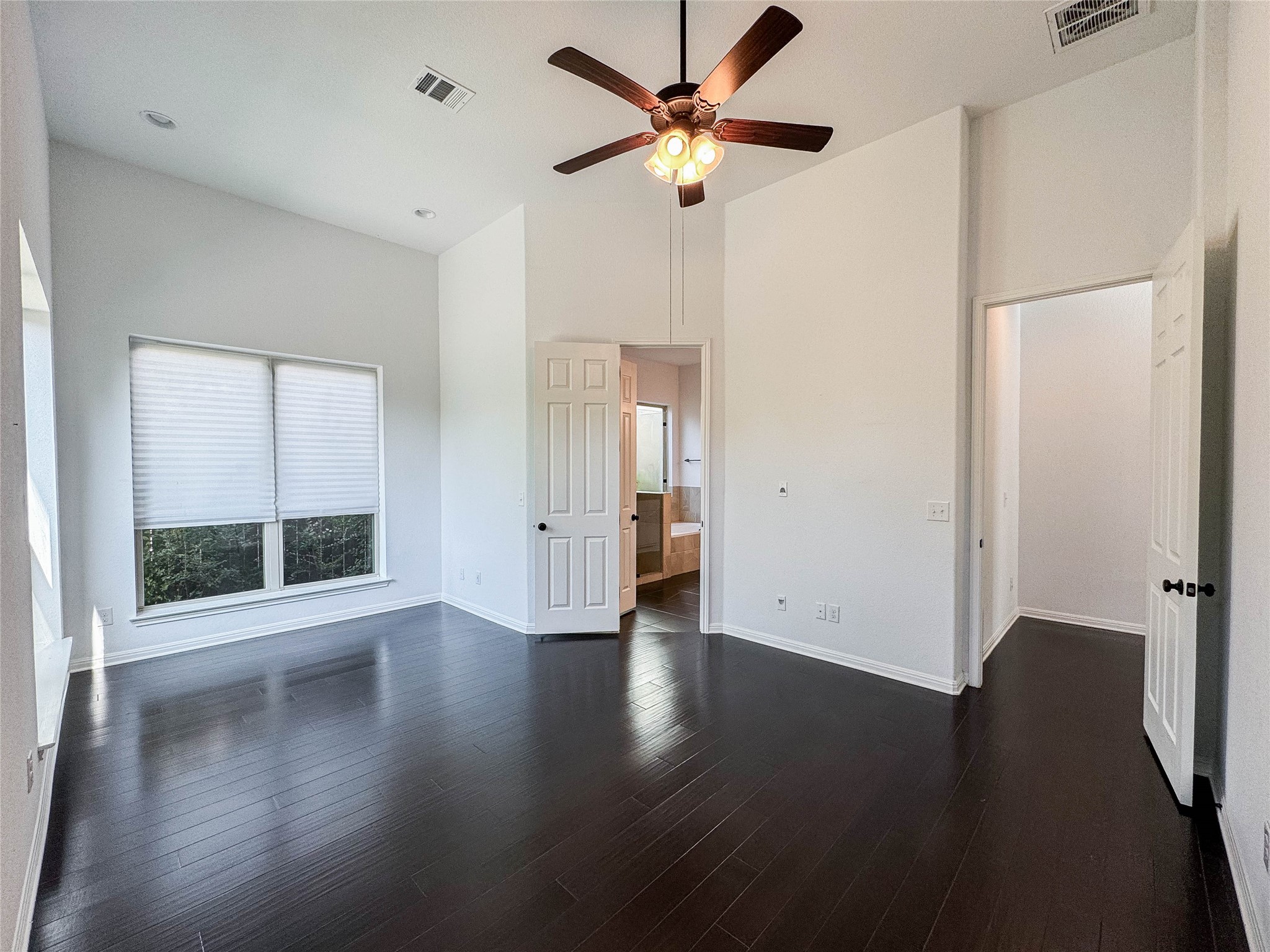 3810 Brushy Creek Road, Unit 73 Cedar Park, TX 78613 - Photo 14 of 42 an empty room with wooden floor and windows