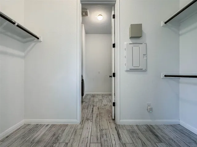a view of a bathroom with wooden floor