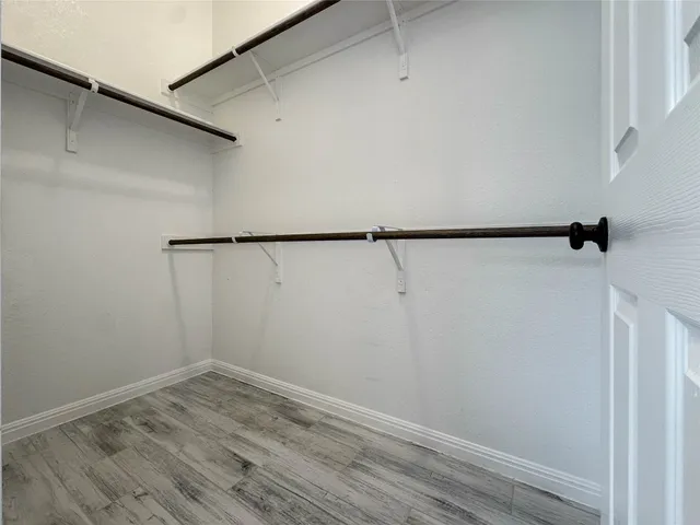 a view of an empty walk in closet