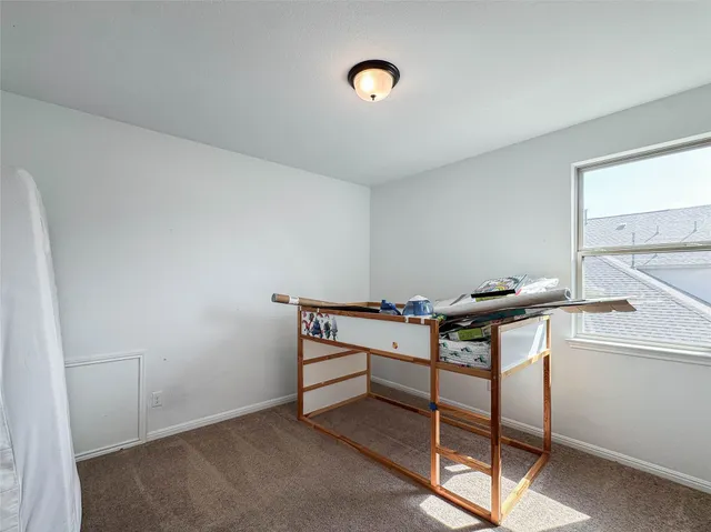 a view of room with table and chair