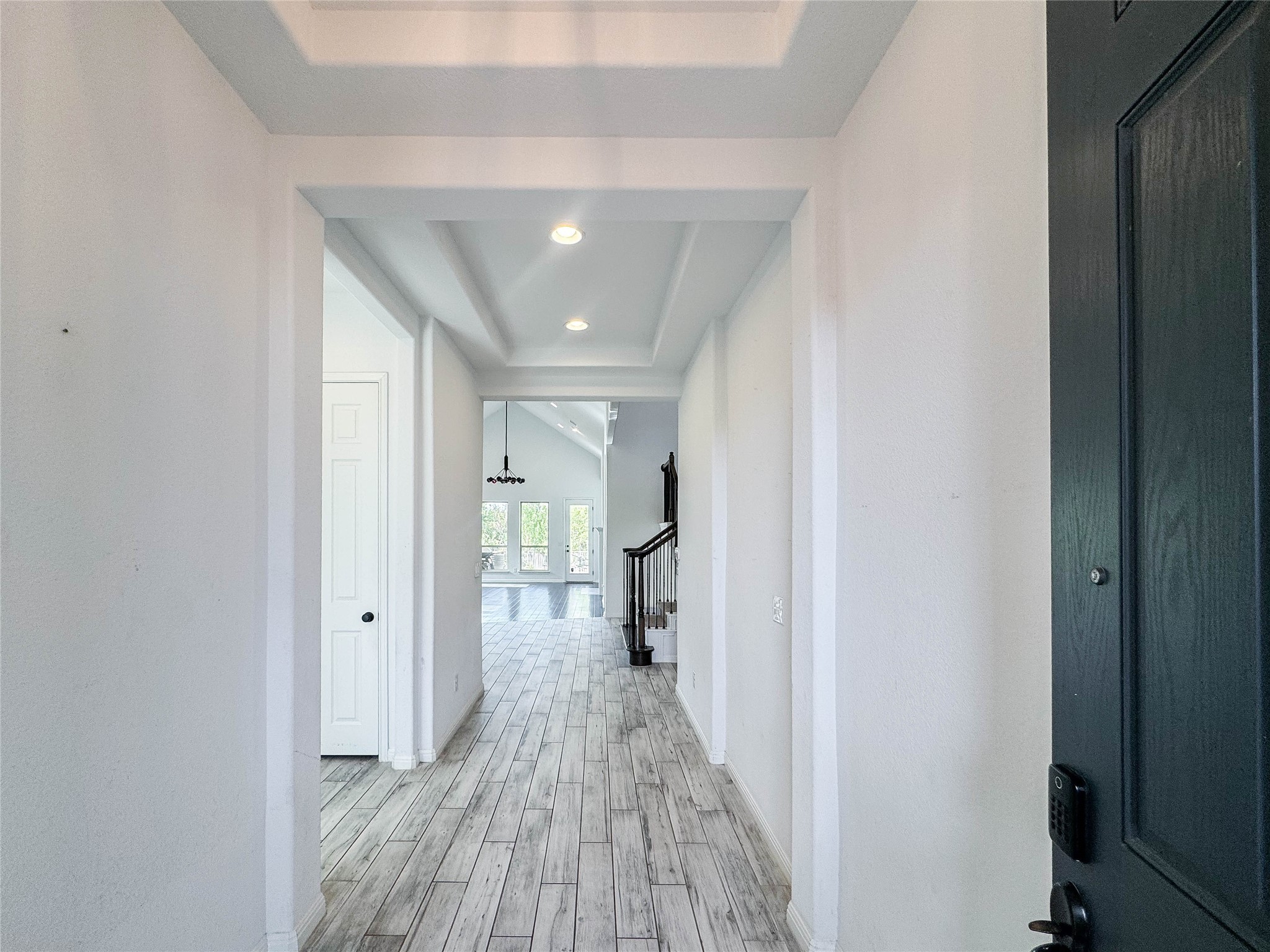 3810 Brushy Creek Road, Unit 73 Cedar Park, TX 78613 - Photo 30 of 42 a view of a hallway with wooden floor and a bathroom