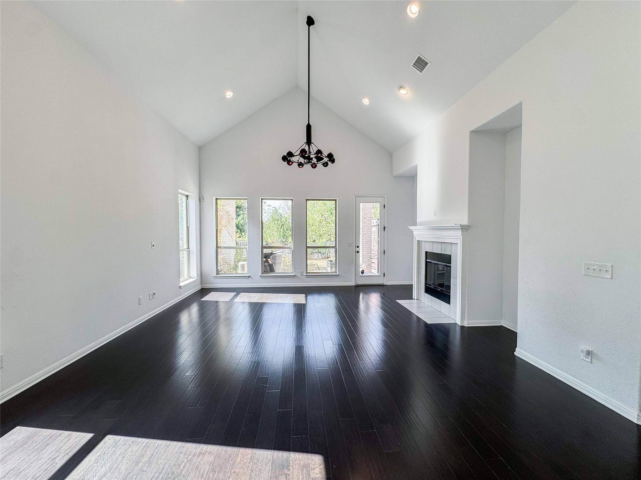 3810 Brushy Creek Road, Unit 73 Cedar Park, TX 78613 - Photo 4 of 42 a view of an empty room with wooden floor and a window