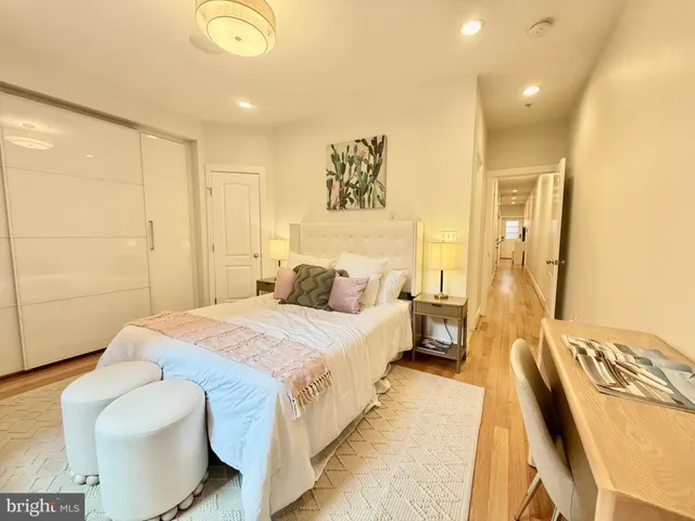 a bedroom with a bed and a couch