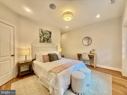 a bedroom with a bed and a table