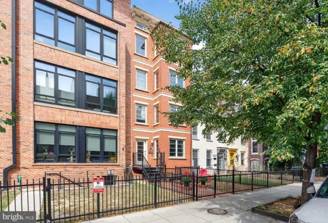 a front view of a building with glass windows