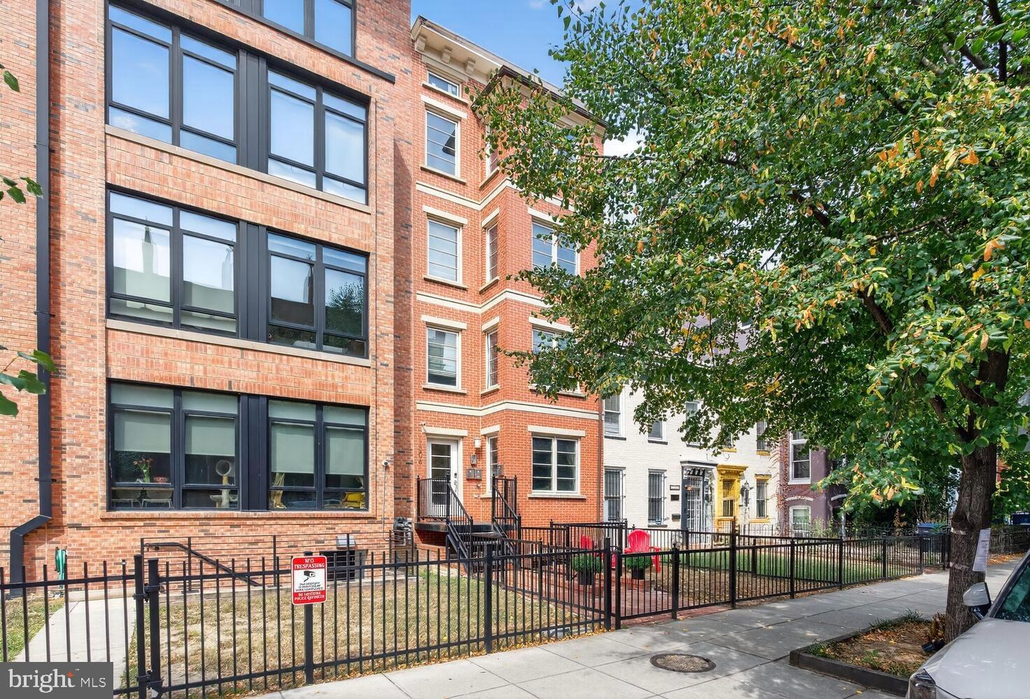 1306 8th Street Northwest, Unit 1 Washington, DC 20001 - Photo 2 of 19 a front view of a building with glass windows