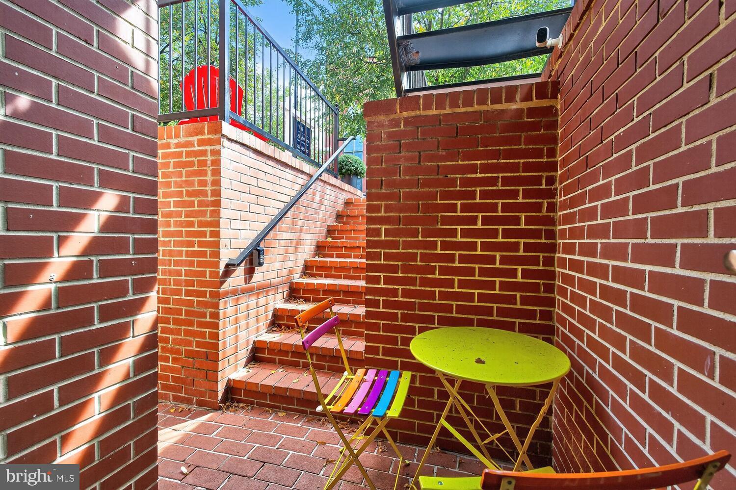 1306 8th Street Northwest, Unit 1 Washington, DC 20001 - Photo 3 of 19 a view of a balcony with chairs and wooden floor