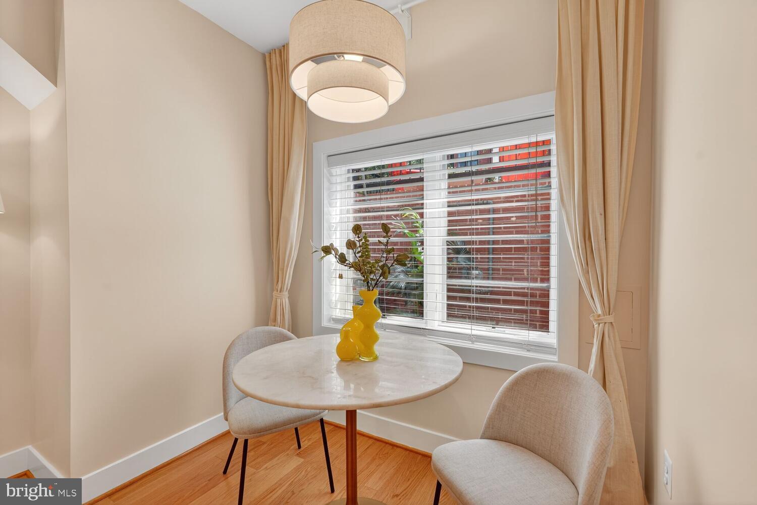 1306 8th Street Northwest, Unit 1 Washington, DC 20001 - Photo 9 of 19 a view of a dining room with furniture window and wooden floor