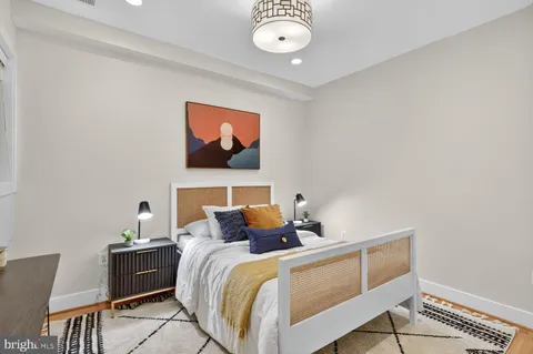 a bedroom with bed and window