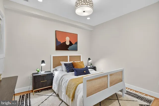 a bedroom with bed and window