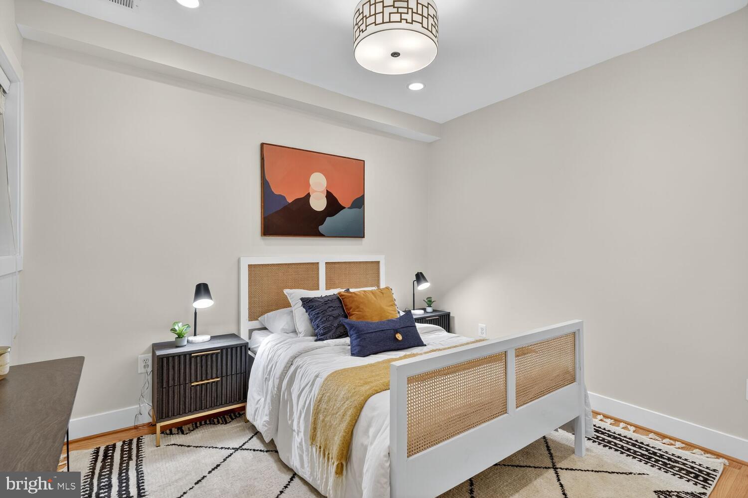 1306 8th Street Northwest, Unit 1 Washington, DC 20001 - Photo 10 of 19 a bedroom with bed and window
