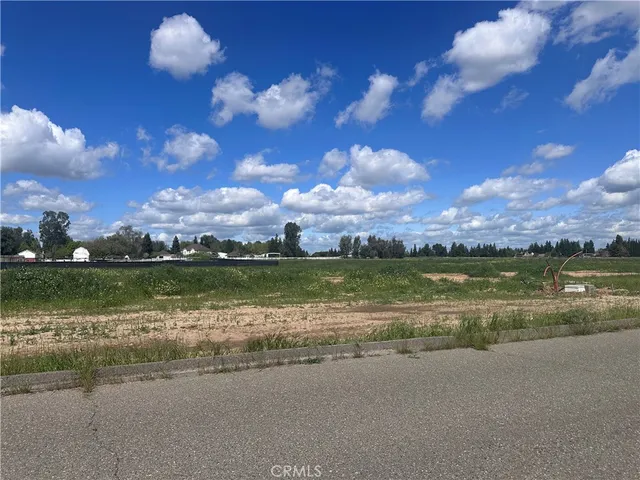 a view of lake with houses in the background
