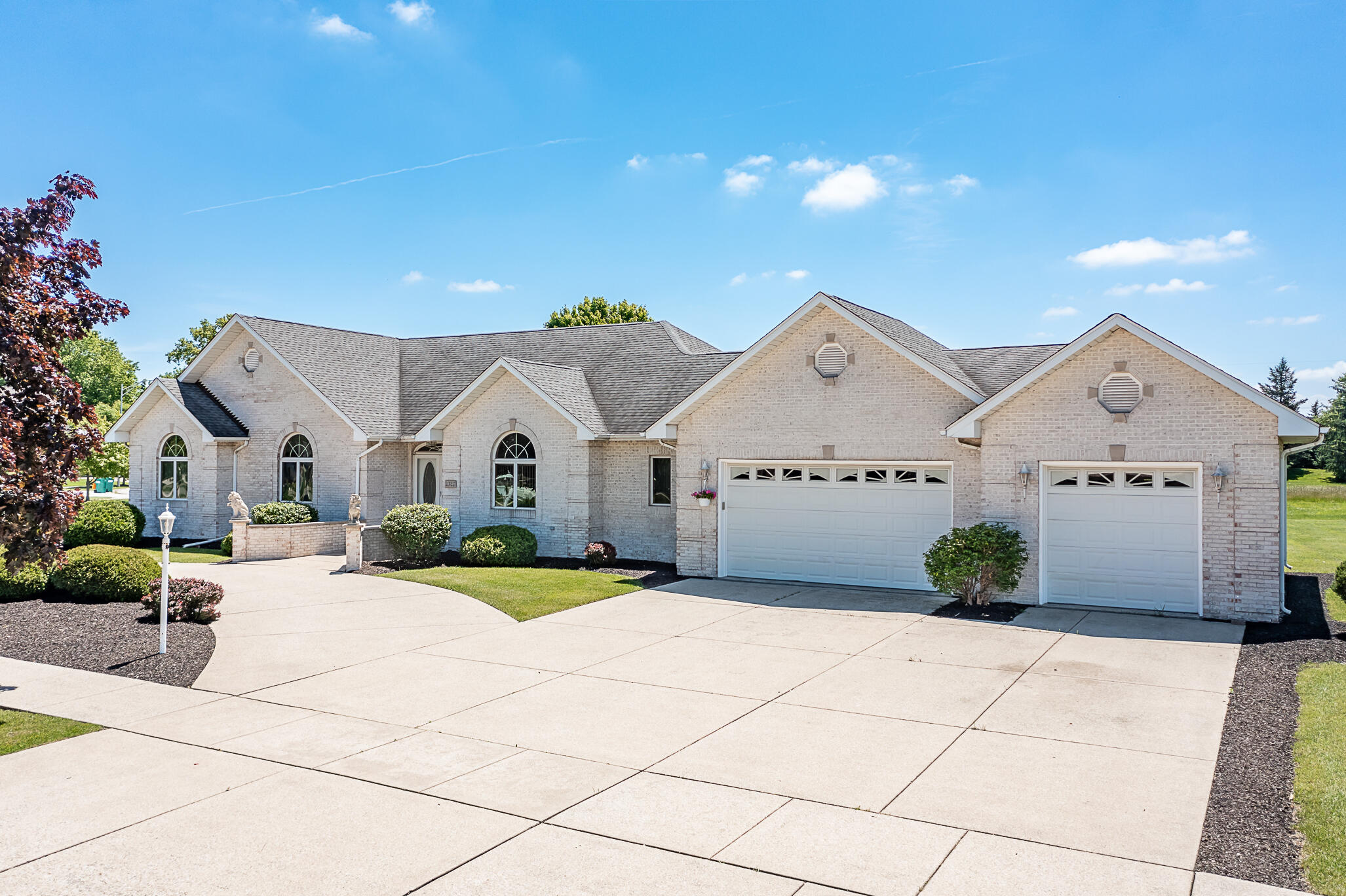 1020 Cornwallis Lane Munster, IN 46321 - Photo 1 of 41 a view of a white house with a yard and potted plants