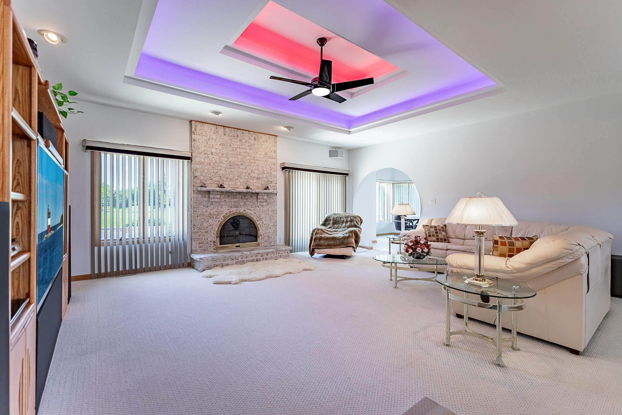1020 Cornwallis Lane Munster, IN 46321 - Photo 13 of 41 a living room with furniture a fireplace and a flat screen tv