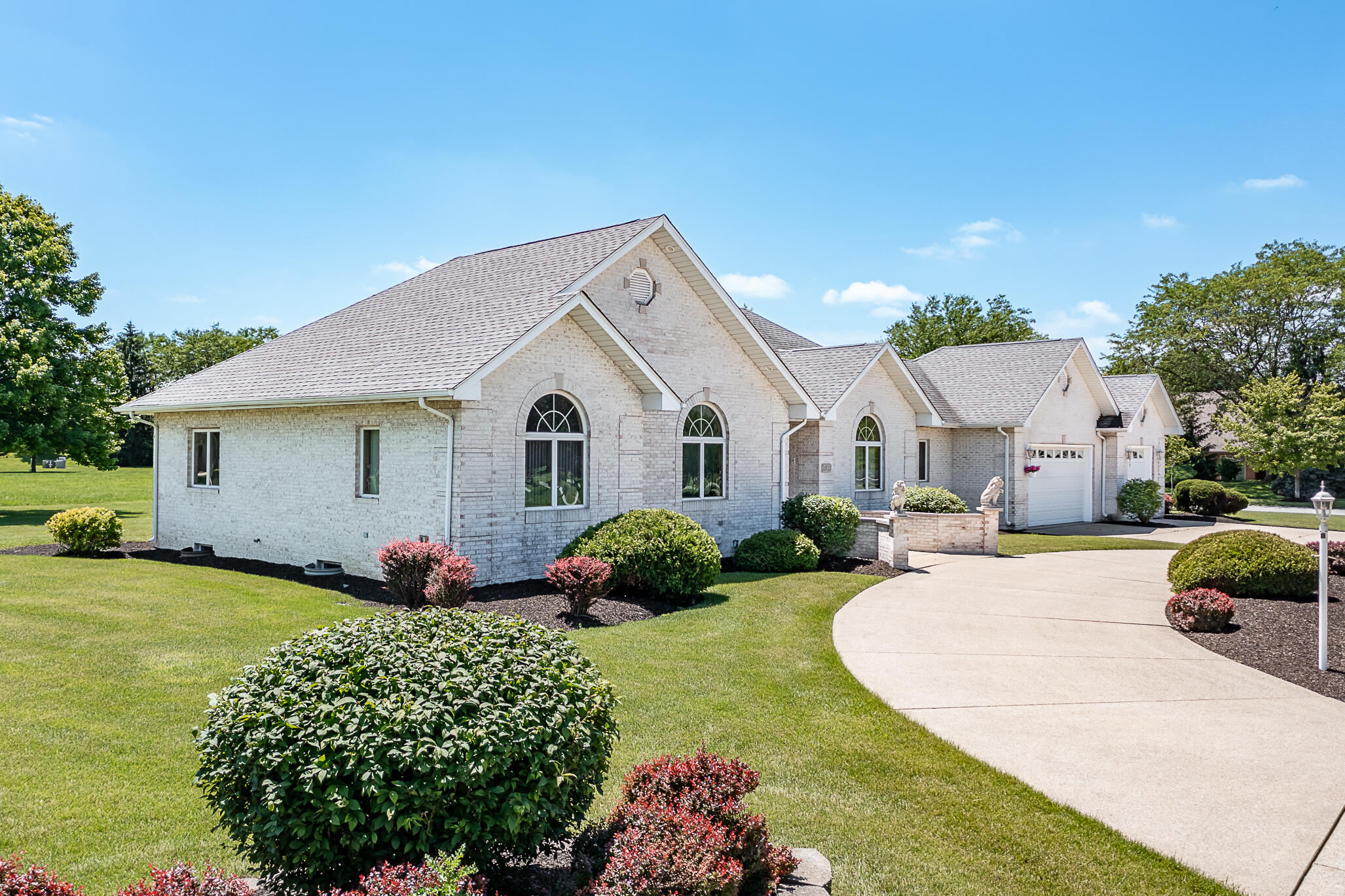 1020 Cornwallis Lane Munster, IN 46321 - Photo 2 of 41 a view of a white house with a big yard and potted plants