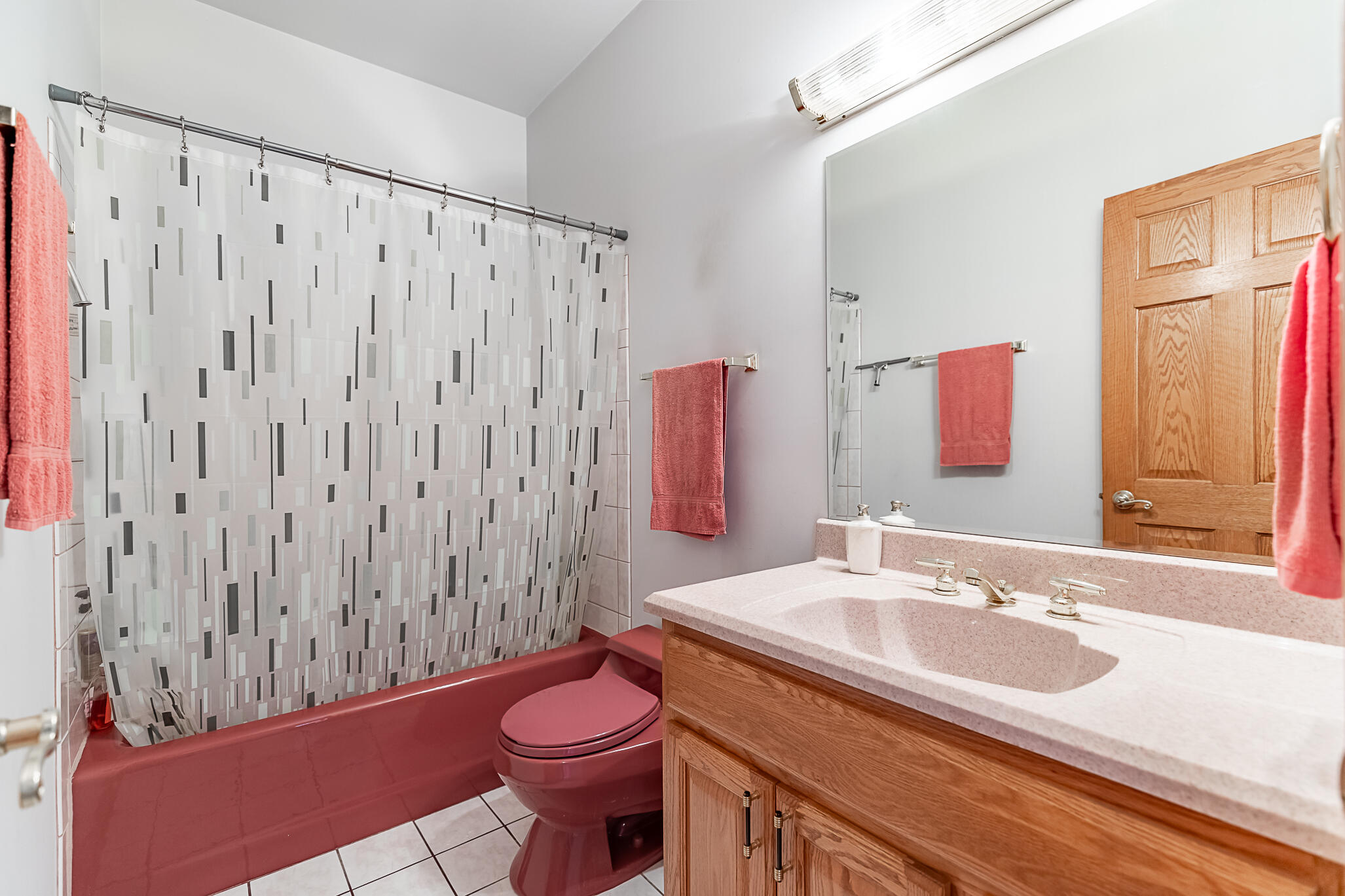 1020 Cornwallis Lane Munster, IN 46321 - Photo 30 of 41 a bathroom with a sink a toilet a mirror and shower curtain